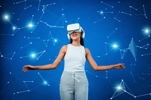 Female standing while wearing white suit and white VR headset connect metaverse, future technology create cyberspace for communicating. She look around enjoy communicate other users. Hallucination.