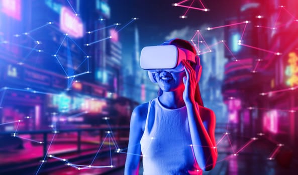 Female standing in cyberpunk style building in meta wear VR headset connecting metaverse, future cyberspace community technology, Woman using hand holding goggles while looking faraway. Hallucination.