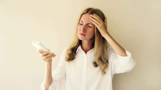 Exhausted woman turns on the air conditioner, suffering from heat, hot weather, high temperature, girl with breathing difficulties in the room using the remote control at home