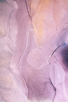 Abstract artwork featuring a close-up of swirling purple and gold ink, creating a beautiful, textured design.
