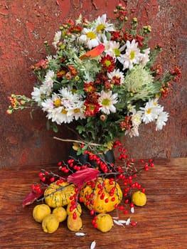 Romantic bouquet of autumn flowers and rustic garden plants. Home decor and the art of flower bouquet arranging