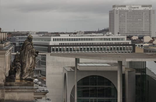 Berlin, Germany - Dec 20, 2023 - Berlin cityscape view from above of Reichstag building with Statue and Marie-Elisabeth-Lueders-Hau and buildings at the downtown Berlin. a major tourist attraction of the berlin city, Space for text, Selective focus.