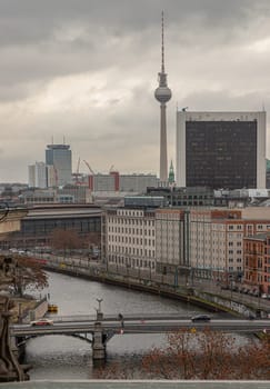 Berlin, Germany - Dec 20, 2023 - Berlin cityscape view from above of Reichstag building with Berlin TV-Tower, Berliner Dom, Marschall Bridge, River Spree and buildings at the downtown Berlin. a major tourist attraction of the berlin city, Space for text, Selective focus.