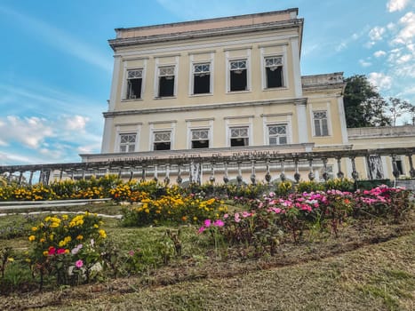 Flower Clock with the Catholic University in the background. Petropolis, Rio de Janeiro, Brazil. May 28, 2024.