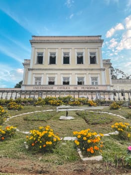 Flower Clock with the Catholic University in the background. Petropolis, Rio de Janeiro, Brazil. May 28, 2024.