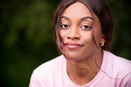 A detailed view of a person wearing a vibrant pink shirt.