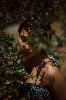 A woman merges with nature, surrounded by leaves and shadows, creating a mystical and dreamy ambiance