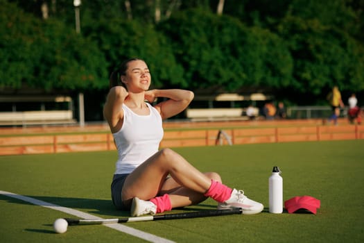 girl hockey player plays field hockey on a sunny day, a hockey player was injured in a game of field hockey, sports injuries