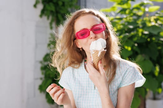 girl eats ice cream balls in hot summer, escape from the girl in pink glasses eats ice cream balls in the hot summer, escape from the heat