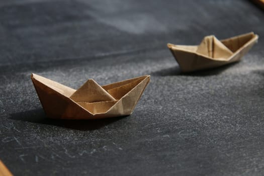 Leadership creative Concept. Paper boats on the table. Its Summer time idea.