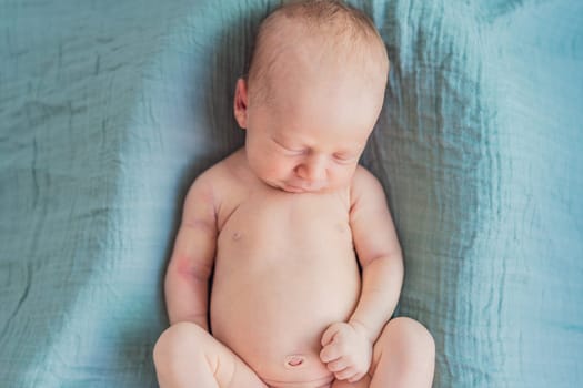 The baby is sleeping peacefully in his cozy nest. Newborn photo session captures the serene innocence and warmth of early moments.