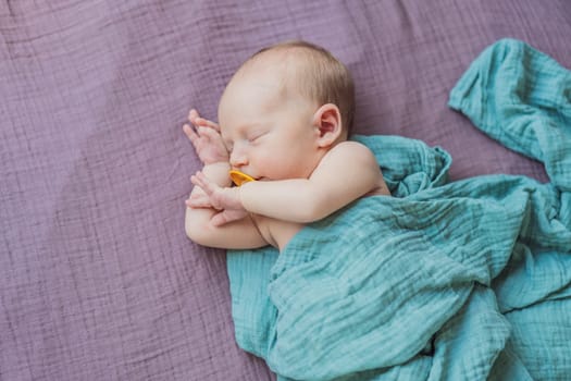 The baby is sleeping peacefully in his cozy nest. Newborn photo session captures the serene innocence and warmth of early moments.