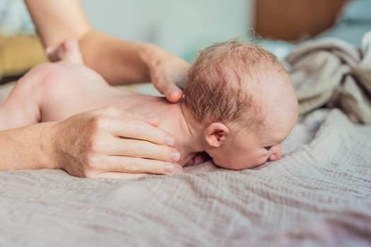 The newborn's skin is peeling. Mom uses skin products and massages to care for and soothe the baby's delicate skin, ensuring comfort and promoting healthy skin.