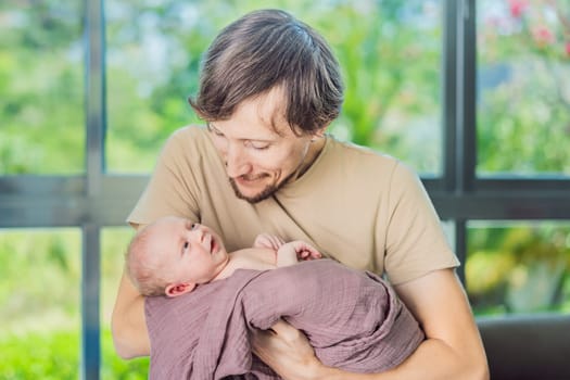 Dad and newborn at home. This tender moment captures the bond between father and child in a loving and comfortable family environment highlighting the joys of parenthood and the warmth of home.