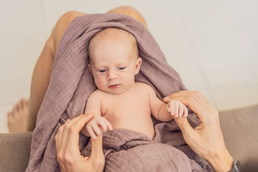 Dad and newborn at home. This tender moment captures the bond between father and child in a loving and comfortable family environment highlighting the joys of parenthood and the warmth of home.