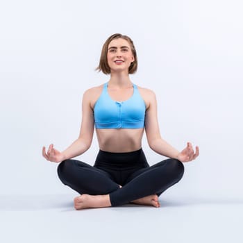 Full body length gaiety shot athletic and sporty woman doing healthy and meditative yoga exercise workout posture on isolated background. Healthy active and body care lifestyle