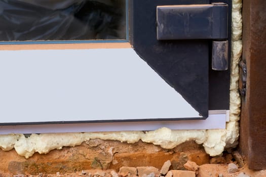 an opening in the wall or roof of a building that is fitted with glass