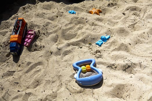 children toys in the sandbox, summer, good weather