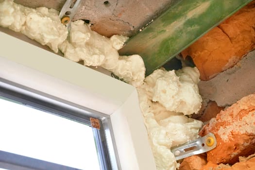 an opening in the wall or roof of a building that is fitted with glass