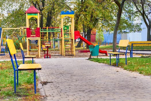 an outdoor area provided for children to play in, especially at a school or public park