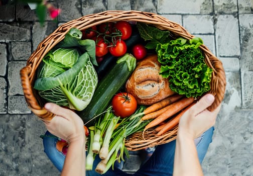 A basket in his hands with vegetables. Autumn harvest. High quality