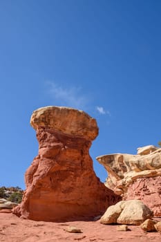 Beautiful view of a unique sandstone rock formation in Cohab Canyon, located within Capitol Reef National Park, Utah. The clear blue sky enhances the dramatic, natural landscape - USA