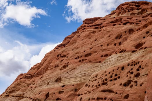 Stunning erosion patterns on red rock formations in Capitol Reef National Park, Utah. Vibrant red rocks against the blue sky showcase the beauty of wind and water erosion - USA