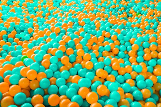 Ball pool playground teal and orange background with copy space for text. High quality photo