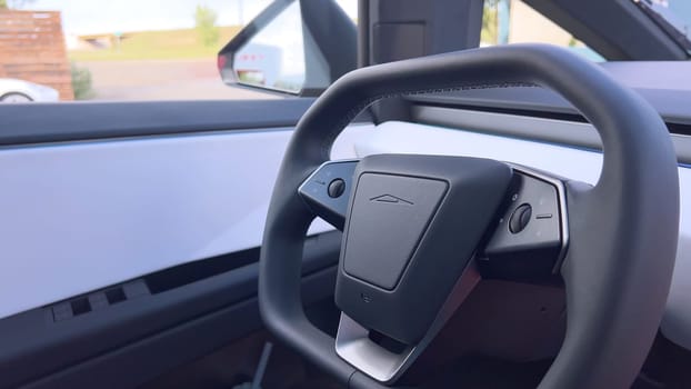 Denver, Colorado, USA-June 11, 2024-Slow motion-The interior of a Tesla car featuring the Dog Mode screen. The display reassures passersby that the driver will be back soon and the air conditioning is set to 69F for the comfort of a pet inside.