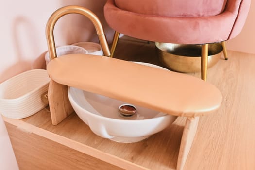 Pink chair and tub for pedicure in a beauty salon