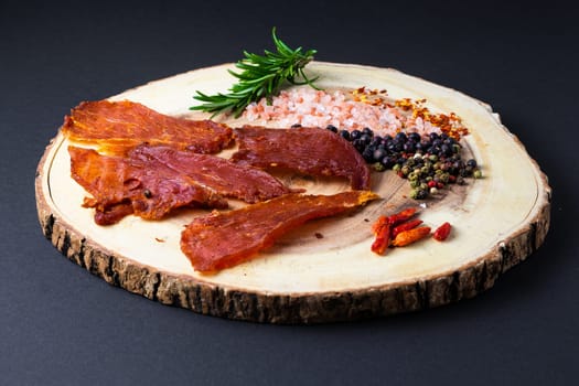 Beef jerky pieces isolated on white and black background