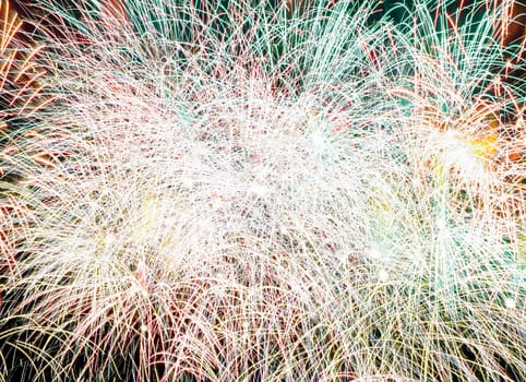 composite closeup photo of fireworks in black night sky.