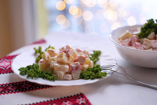 Traditional Ukrainian food on the table with embroidered tablecloth.