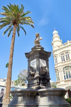 Fragment of facade of Gabinete Literario de Las Palmas de Gran Canaria. Monument to A. Cairasco on Gabinete Literario on background