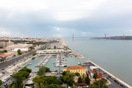 Yacht parking on the coast of the Atlantic Ocean in the suburbs of Lisbon, Portugal. Marina in Belem Aerial view