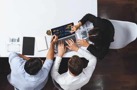Group of office worker and businesspeople working on business financial data analysis. Empty space with editable blank background meeting table for customer design. Prudent