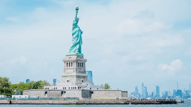 The Statue of Liberty, New York City on sunny blue sky. American symbol. Memorial day, Patriot Day. Space for text. New York NY USA 2023-07-30.