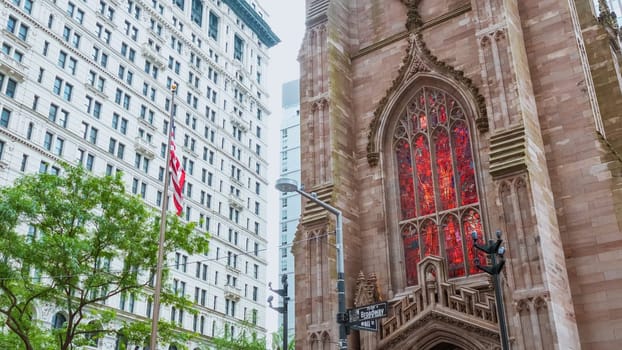 Iconic Trinity Church in Manhattan, New York City, showcases stunning Gothic Revival architecture blending history with modernity in the bustling cityscape, a captivating view.