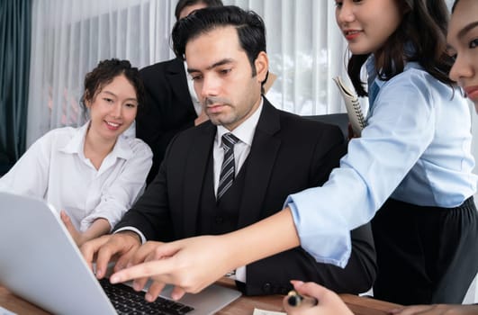 Diverse of business people from various ethnic group working in modern office environment. Productive and multi ethnic office workers engage in discussion for strategic business marketing. Habiliment