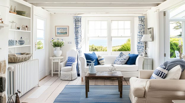 Interior of a living room with white walls, sofa and cushions. Sitting room in coastal cottage with sea view. Luxury lounge room