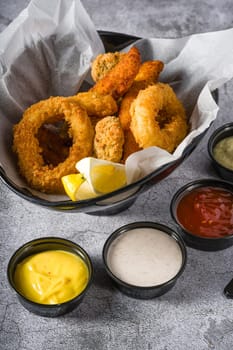 Deep fried squid, shrimp and mussels with sauces on the side