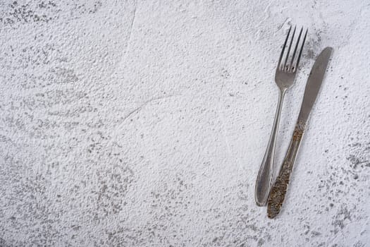 top view of vintage cutlery on stone table