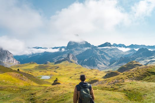 Young traveler with backpack hiking mountain. Travel Lifestyle and Adventure concept. High quality photo