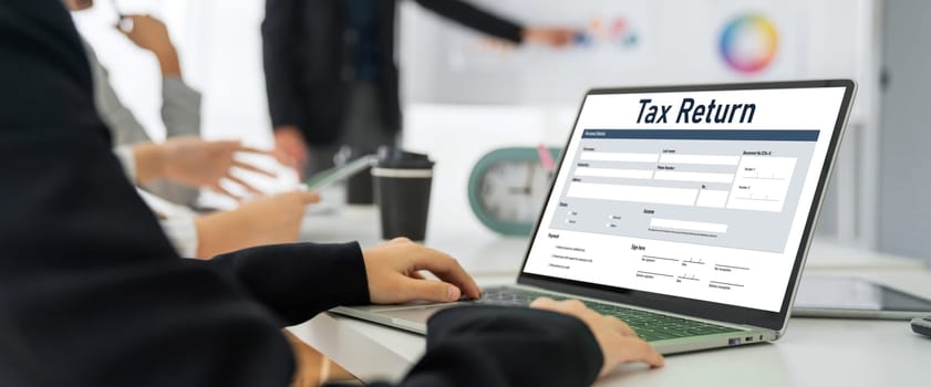 Online tax return form for submitting individual income tax return form snugly on the internet website. Government web for tax payment and return. Taxation technology concept.