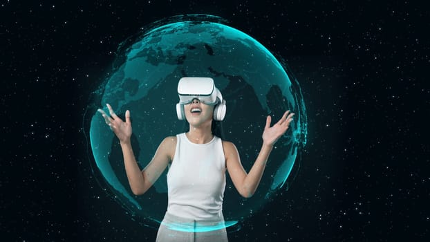 Excited Woman in VR interacting rotating digital globe representation 3D hologram world network communication technology innovation visual animation studio portrait starry background. Hallucination.