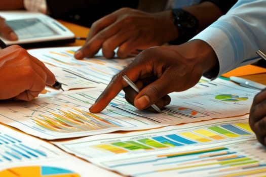 Close up of group of professional business people hands looking at financial plan. Top view of marketing team and project manager discussing and brainstorming idea while planning by paper. AIG42.