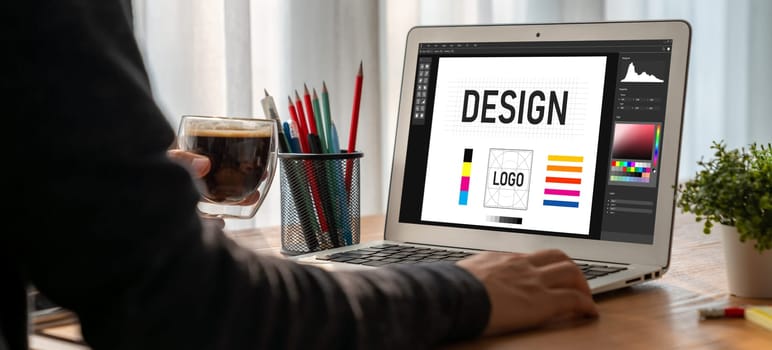 Graphic designer software for modern design of web page and commercial ads showing on the computer screen