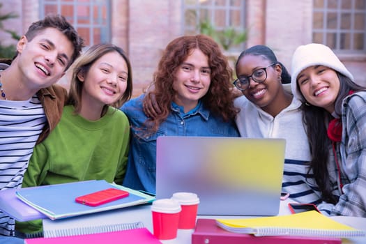 Group of students, meet on university campus work together on creative tasks, prepare for university exams, use laptop. Education, study of university life concept.