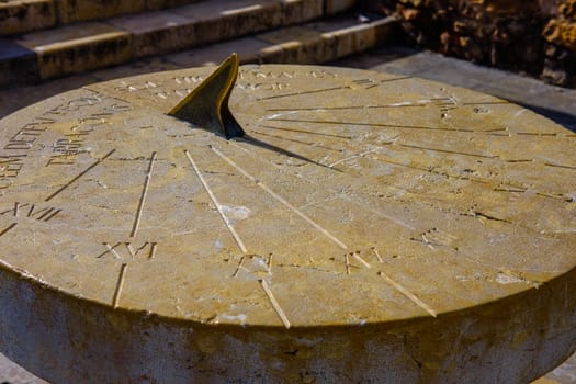 a clock that casts a shadow from the time of the Roman Empire. located in one of the Spanish cities