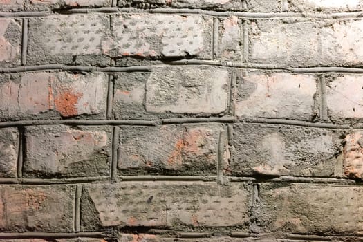 Close-up of a red brick wall.